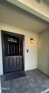an empty room with wooden floor and fireplace