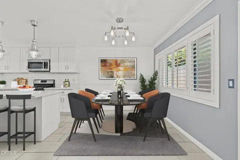 a kitchen with cabinets appliances a sink and a stove