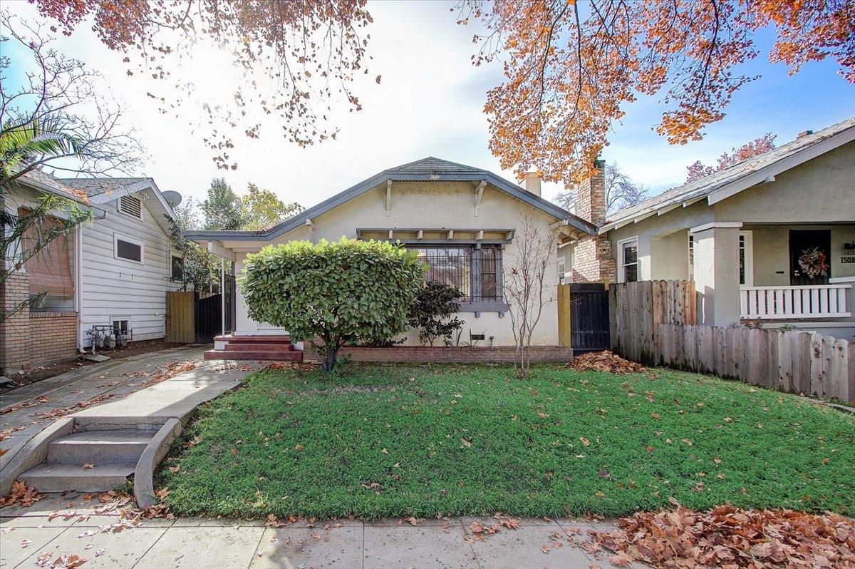 1514 U Street Sacramento, CA 95818 - Photo 1 of 39 a front view of a house with a yard and porch