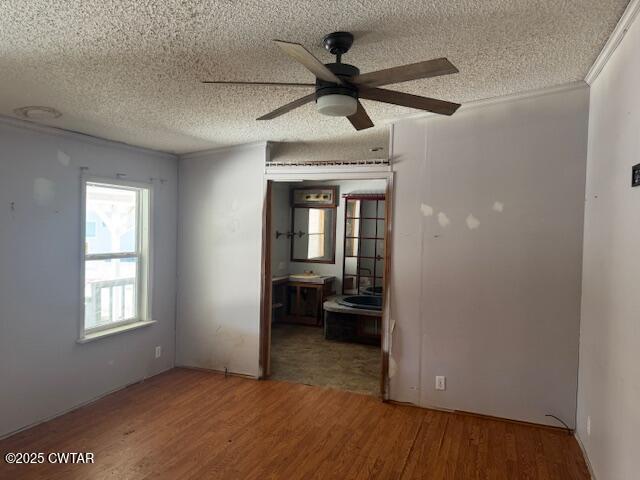 15 Brookwood Loop Adamsville, TN 38310 - Photo 2 of 9 a view of a livingroom with a ceiling fan and wooden floor
