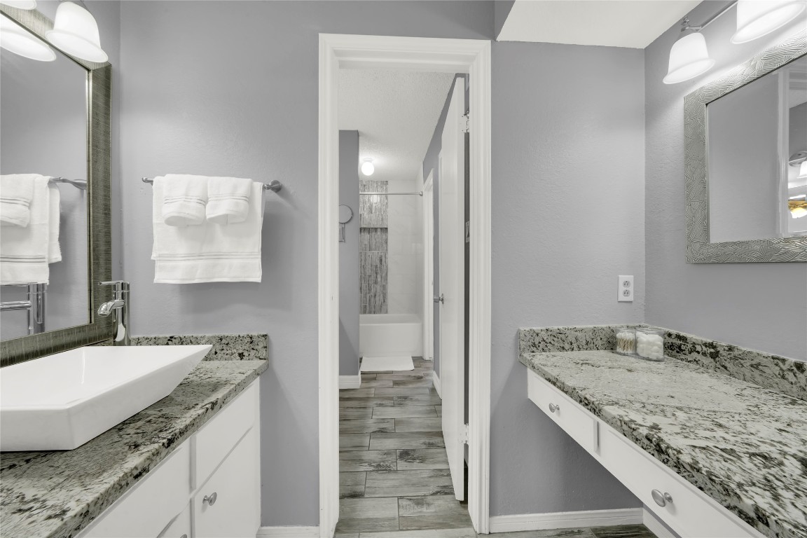 3600 Jeanetta Street, Unit 601 Houston, TX 77063 - Photo 14 of 24 a bathroom with a granite countertop sink and a mirror