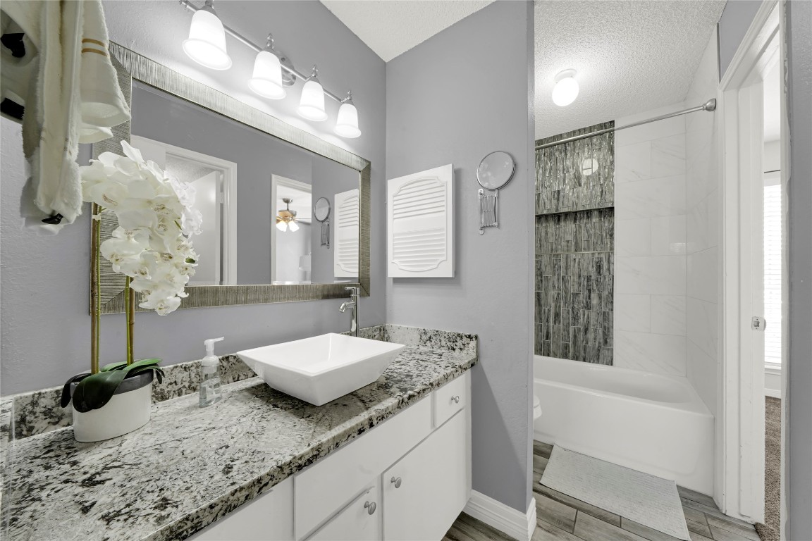 3600 Jeanetta Street, Unit 601 Houston, TX 77063 - Photo 15 of 24 a bathroom with a granite countertop sink and a mirror