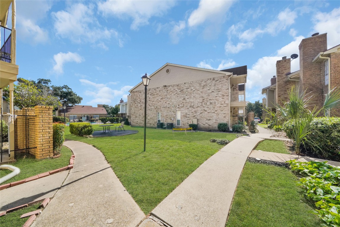 3600 Jeanetta Street, Unit 601 Houston, TX 77063 - Photo 2 of 24 a view of a building with a yard