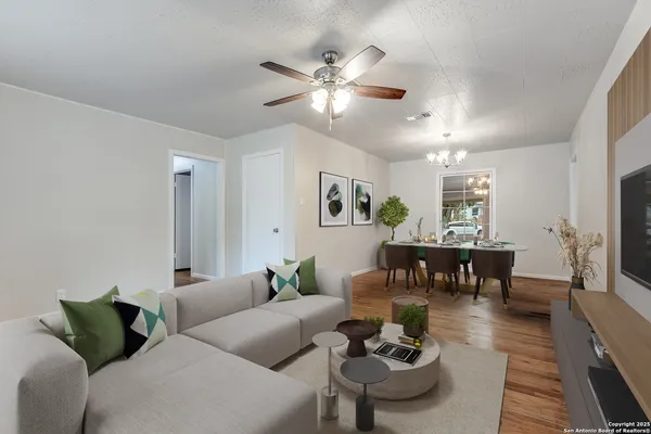 a living room with furniture and a table