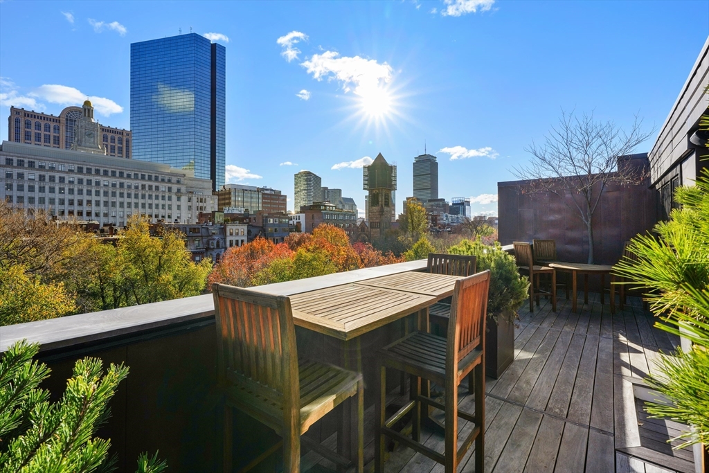 45-47 Commonwealth Avenue, Unit 5 Boston, MA 02116 - Photo 12 of 19 a view of a balcony with furniture and a potted plant
