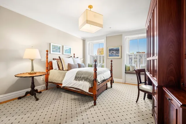 a bed room with a bed and a lamp