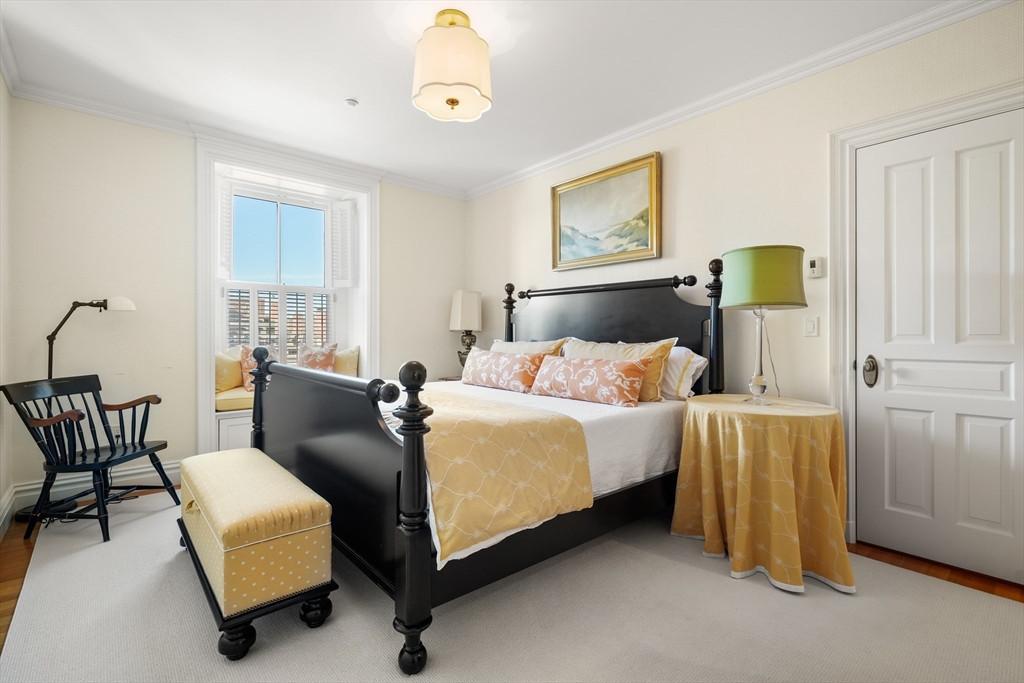 45-47 Commonwealth Avenue, Unit 5 Boston, MA 02116 - Photo 16 of 19 a bed room with a bed and a couch