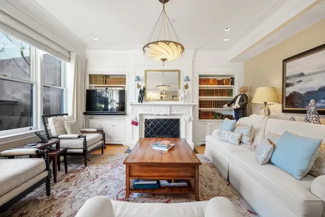 a living room with furniture fireplace and a flat screen tv