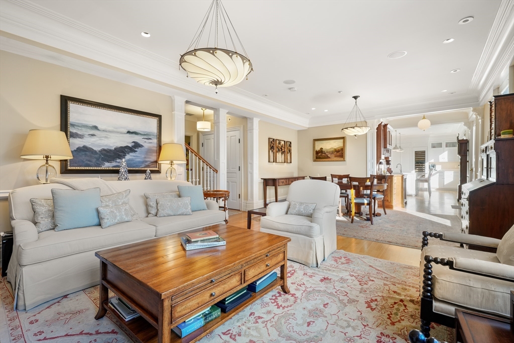 45-47 Commonwealth Avenue, Unit 5 Boston, MA 02116 - Photo 4 of 19 a living room with furniture a table and chairs
