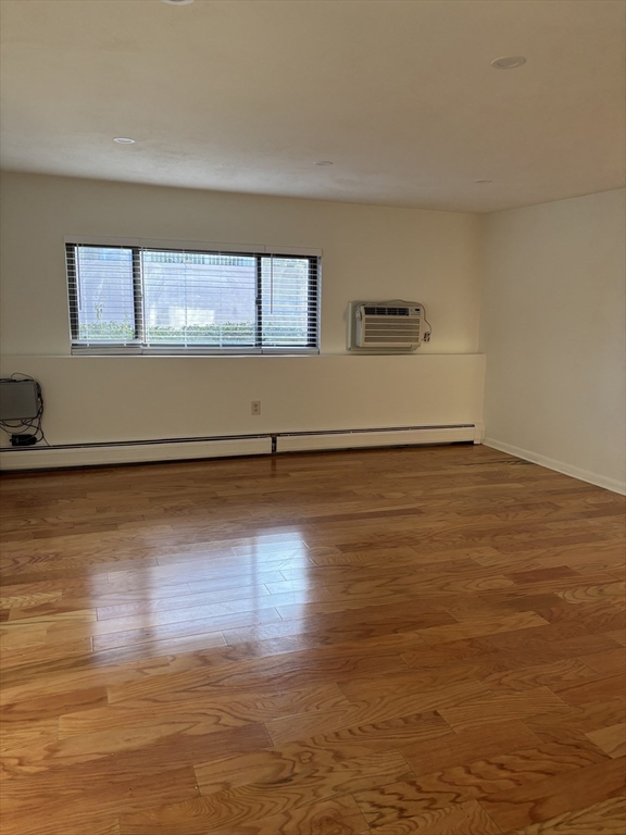 146 Willow Street, Unit 4 Waltham, MA 02453 - Photo 5 of 13 a view of a room with wooden floor
