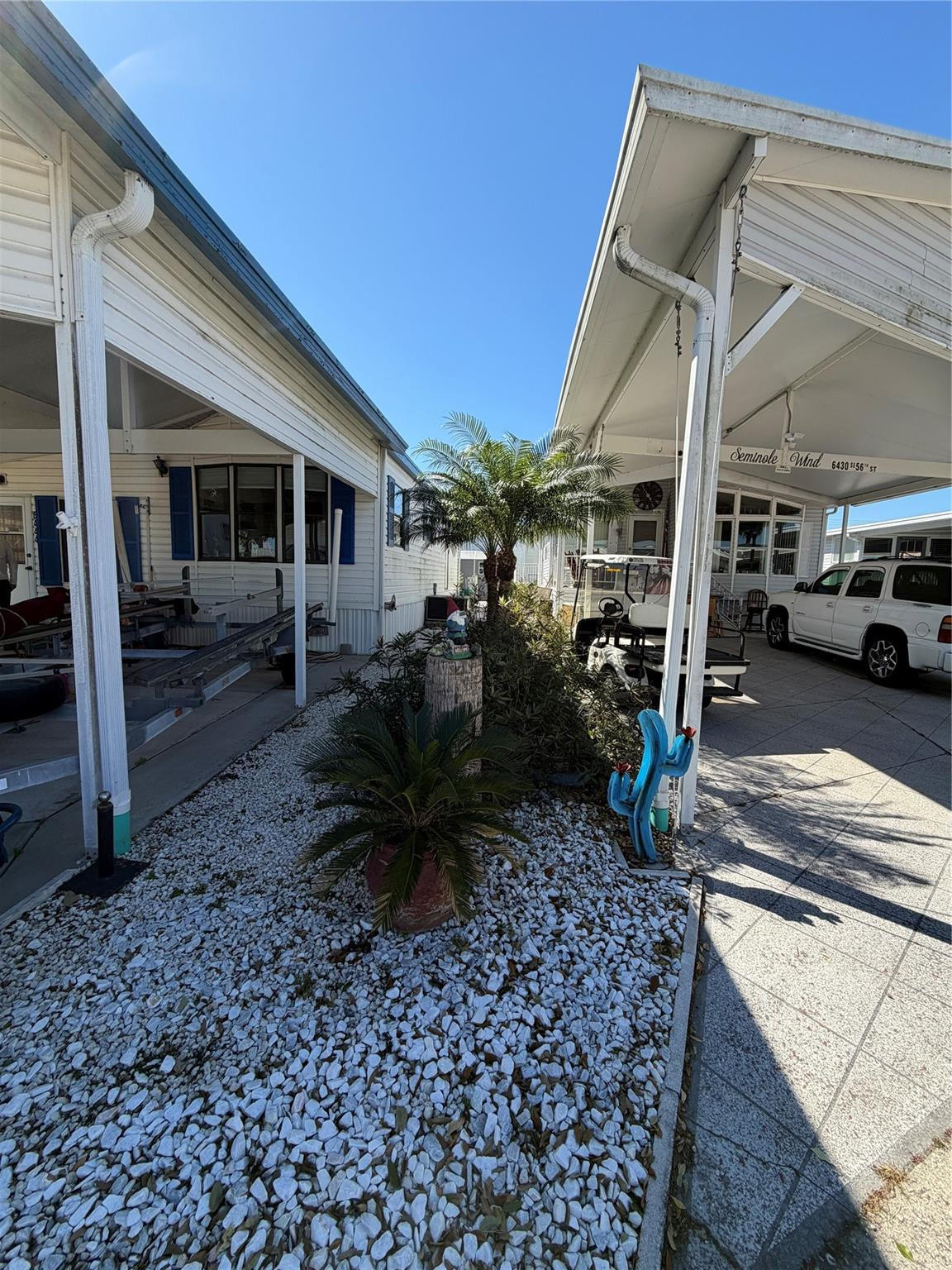 6444 Southeast 56th Street Okeechobee, FL 34974 - Photo 11 of 13 a view of a house with backyard and porch