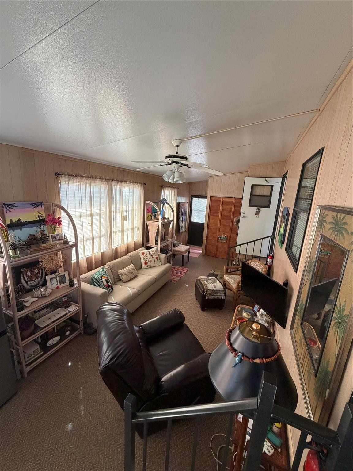 6444 Southeast 56th Street Okeechobee, FL 34974 - Photo 2 of 13 a view of a livingroom with furniture and a ceiling fan