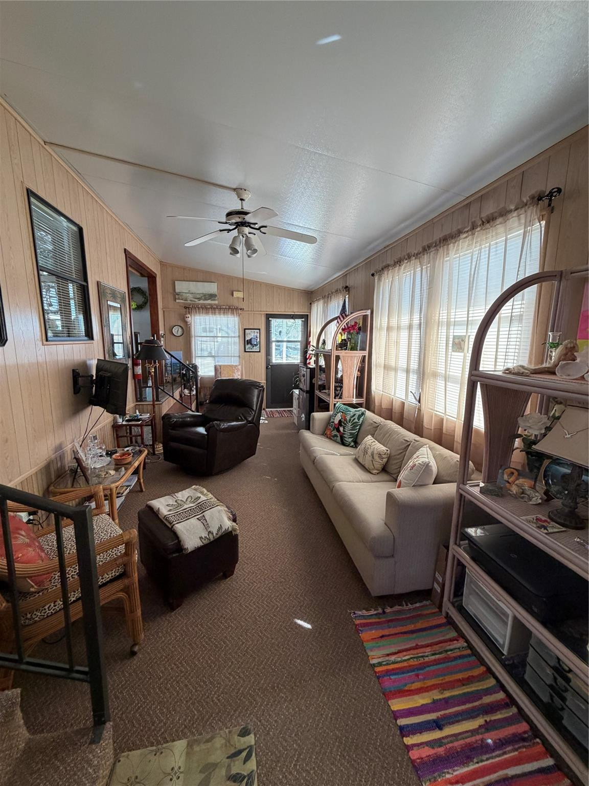 6444 Southeast 56th Street Okeechobee, FL 34974 - Photo 4 of 13 a living room with furniture a rug and a window