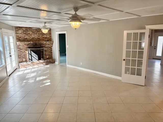 a kitchen with a sink cabinets and window