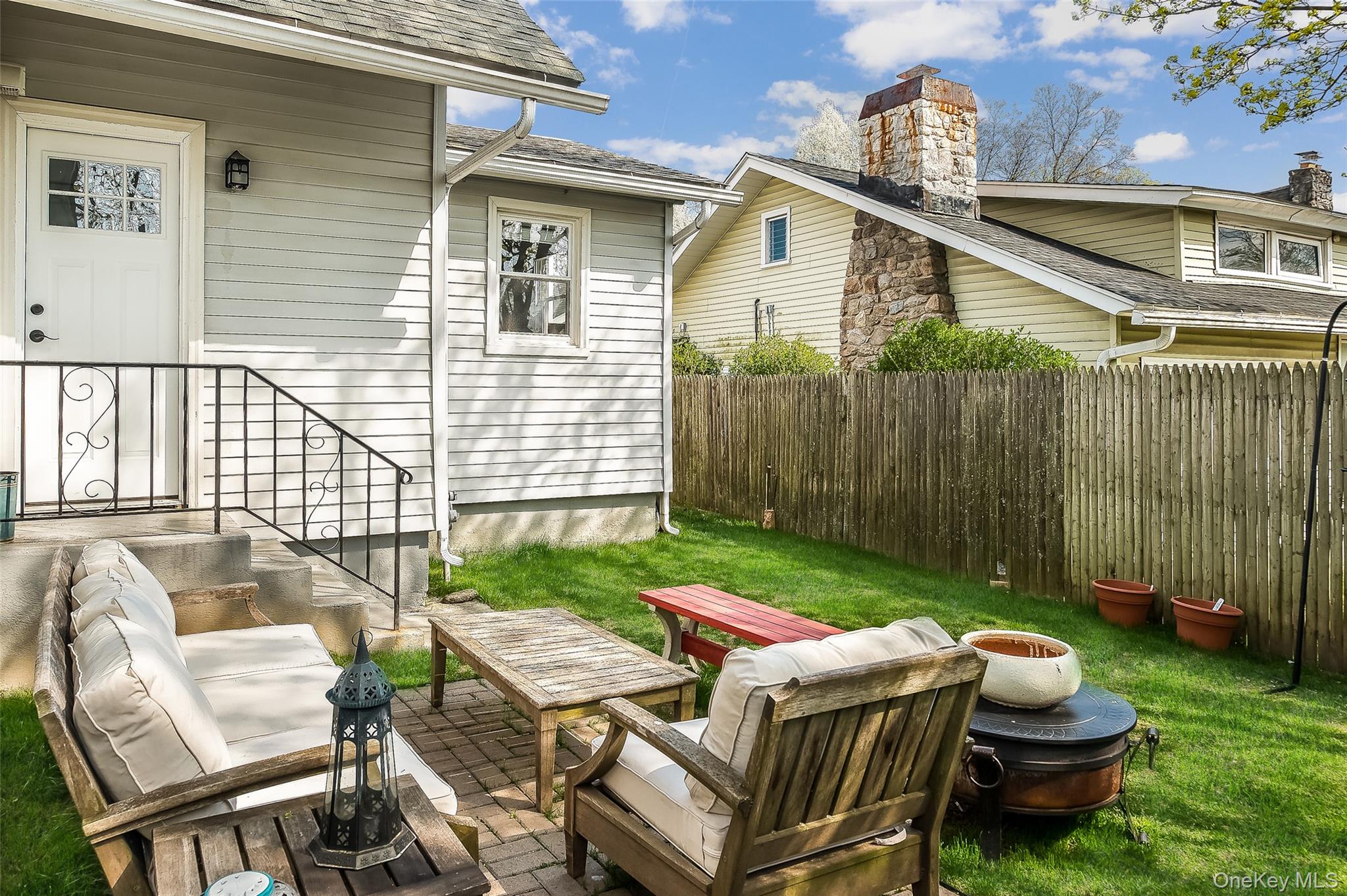 36 Dearborn Avenue Rye, NY 10580 - Photo 22 of 30 a view of a patio with table and chairs and potted plants