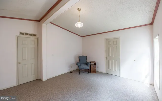 a view of livingroom with furniture and staircase