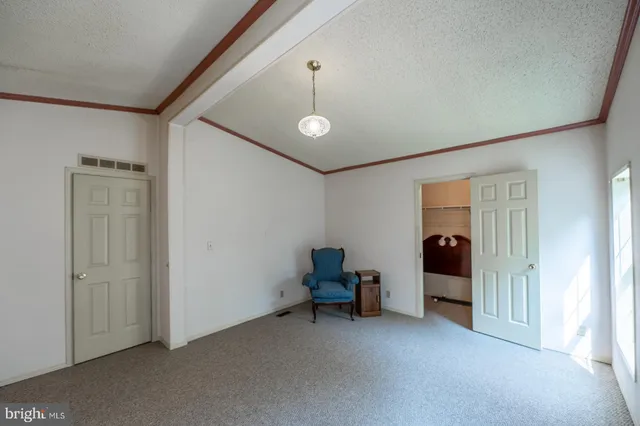a bathroom with a granite countertop sink mirror and a bath tub