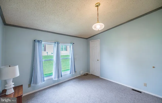 a kitchen with stainless steel appliances granite countertop a refrigerator and a stove