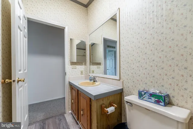 a kitchen with a refrigerator and a sink