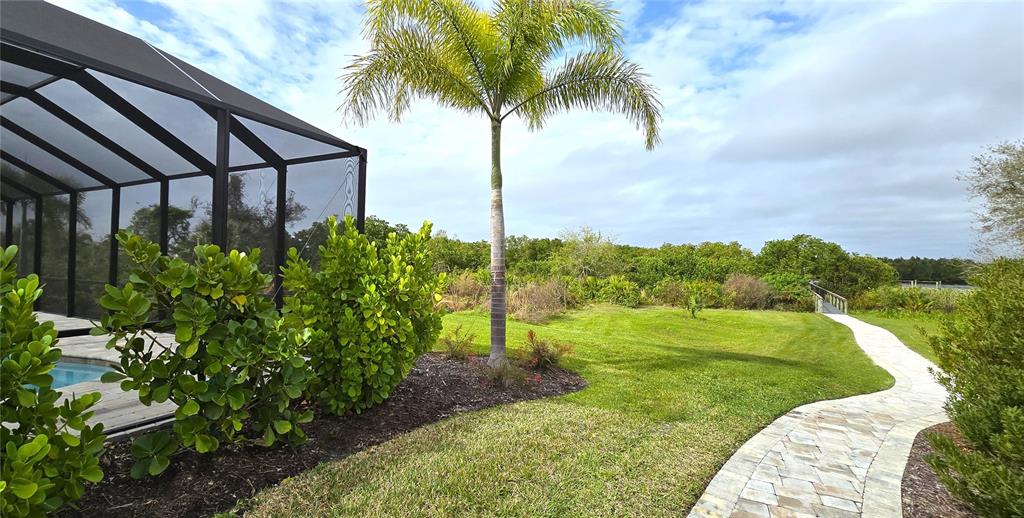2049 Treasure Lane Punta Gorda, FL 33982 - Photo 55 of 72 a view of a backyard with plants
