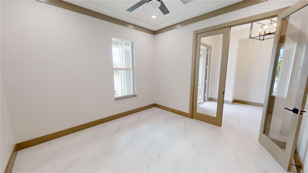 2049 Treasure Lane Punta Gorda, FL 33982 - Photo 7 of 72 a view of a room with a staircase and a hallway