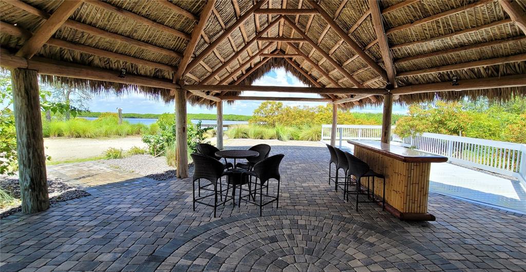 2049 Treasure Lane Punta Gorda, FL 33982 - Photo 71 of 72 a view of a patio with table and chairs and wooden floor