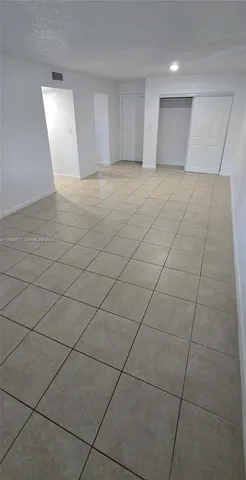 an empty room with a bathroom