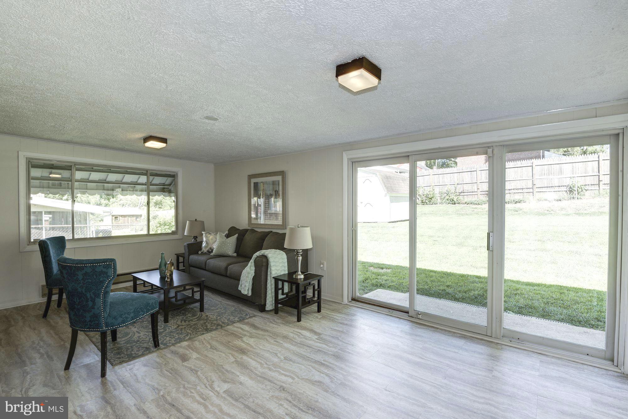 9816 Cottrell Terrace Silver Spring, MD 20903 - Photo 11 of 22 Enclosed sunroom opens to fenced yard