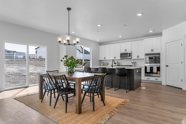 342 North Rhyolite Drive, Unit 88 Hurricane, UT 84737 - Photo 7 of 26 Open concept living area with wood-finish flooring