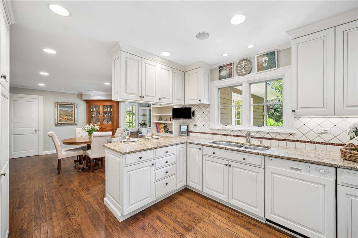 253 Summerfield Road Northbrook, IL 60062 - Photo 17 of 46 a kitchen with sink stove and cabinets
