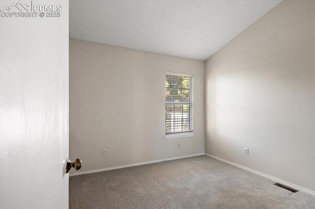 2531 Blazek Loop Colorado Springs, CO 80918 - Photo 11 of 29 an empty room with windows