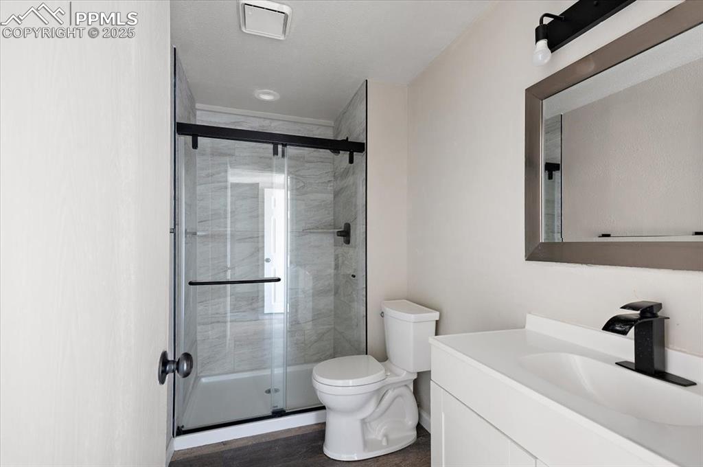 2531 Blazek Loop Colorado Springs, CO 80918 - Photo 15 of 29 a bathroom with a sink toilet and shower