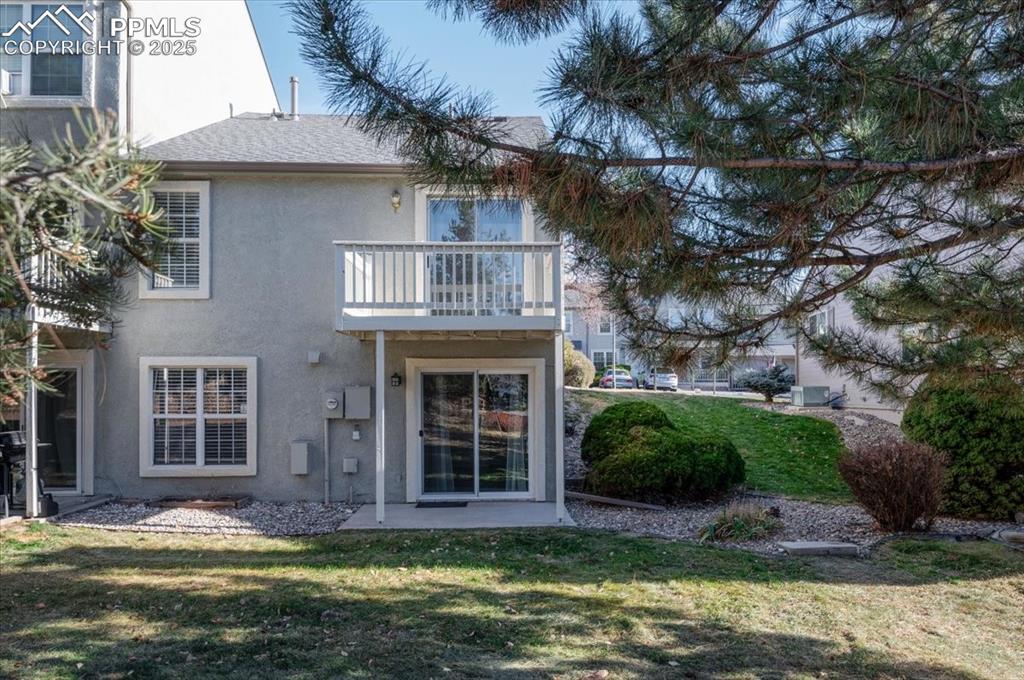 2531 Blazek Loop Colorado Springs, CO 80918 - Photo 20 of 29 a view of a house with a yard