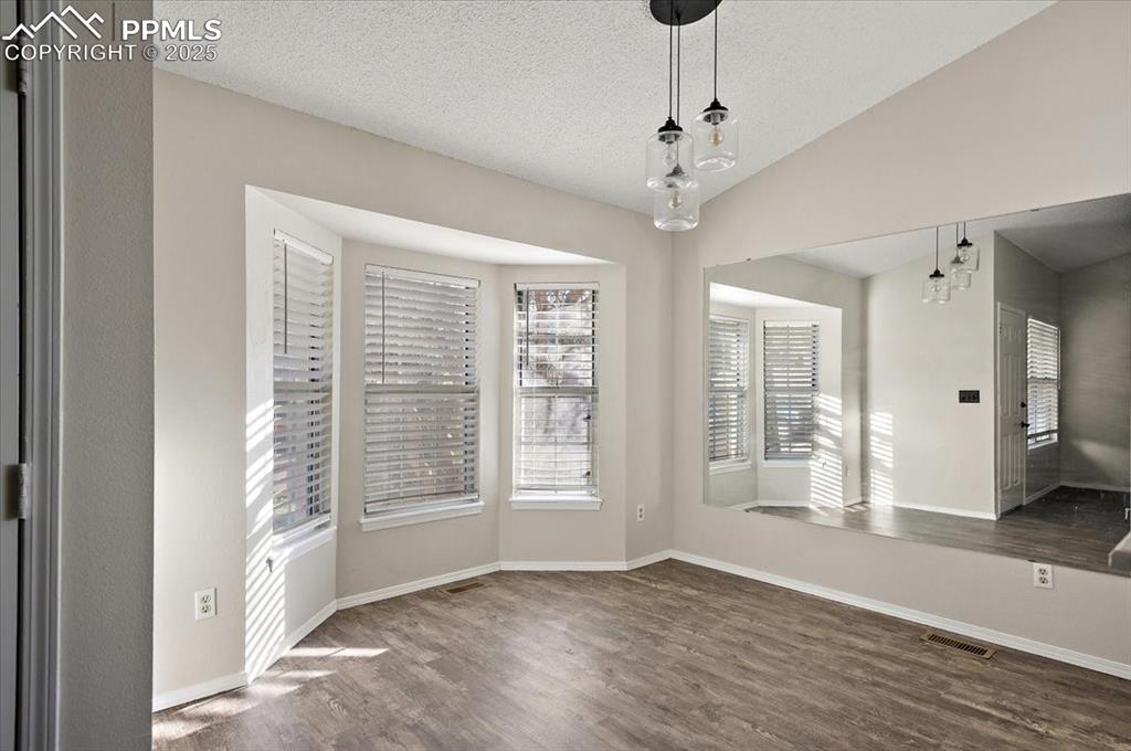 2531 Blazek Loop Colorado Springs, CO 80918 - Photo 3 of 29 a view of an empty room with a window