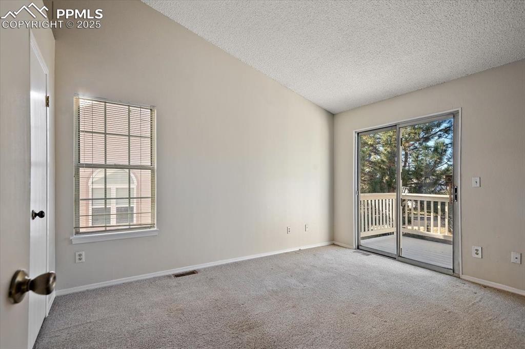 2531 Blazek Loop Colorado Springs, CO 80918 - Photo 7 of 29 an empty room with windows