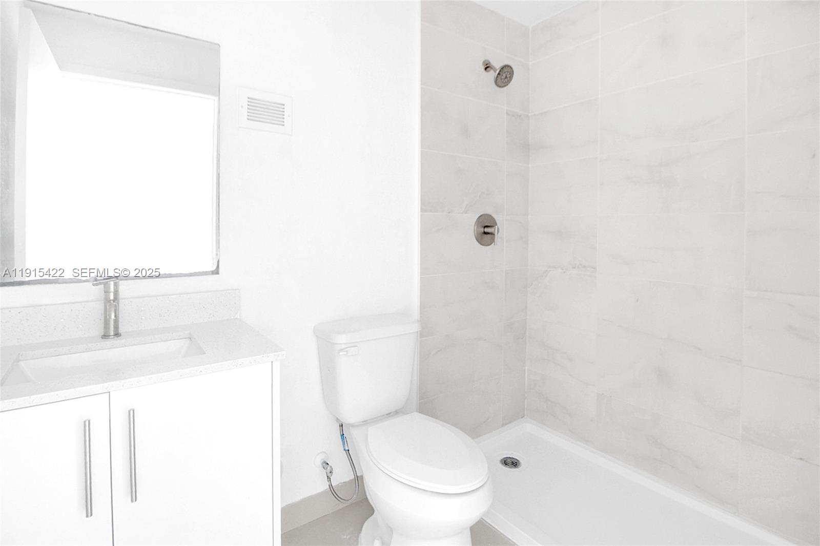 14482 Southwest 259th Street Homestead, FL 33032 - Photo 13 of 35 a white toilet sitting next to a bathroom sink