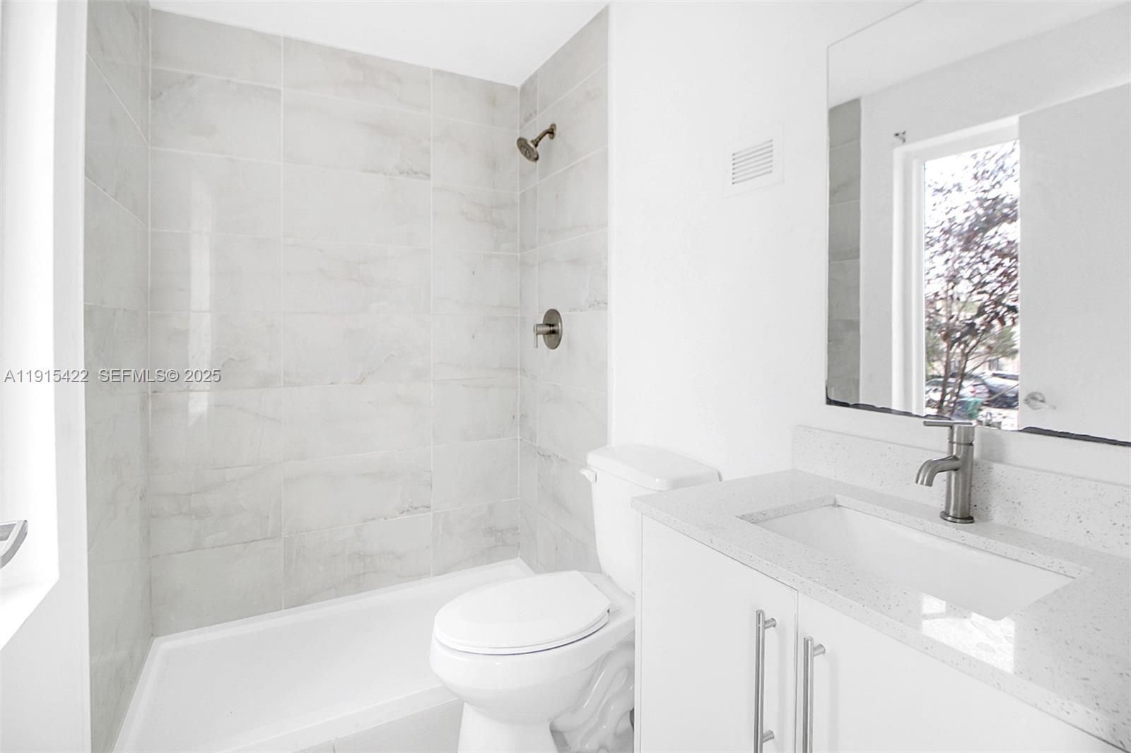 14482 Southwest 259th Street Homestead, FL 33032 - Photo 16 of 35 a bathroom with a sink toilet and shower