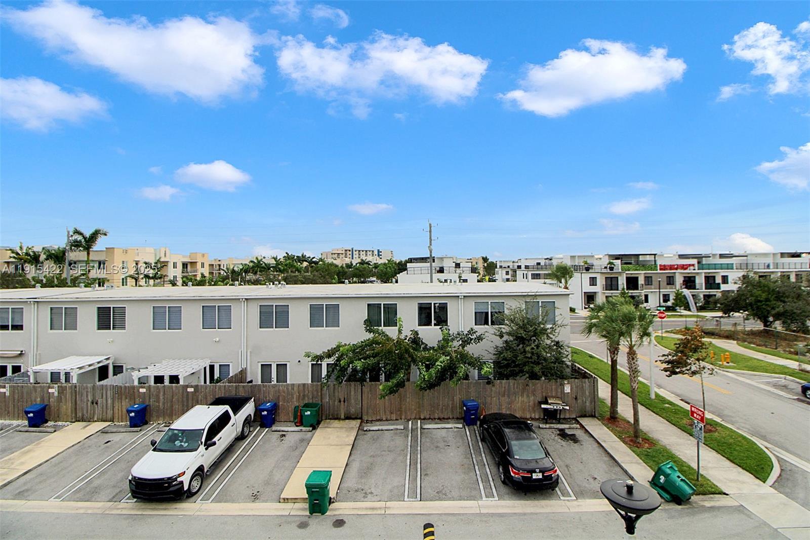 14482 Southwest 259th Street Homestead, FL 33032 - Photo 24 of 35 a view of a balcony with cars parked