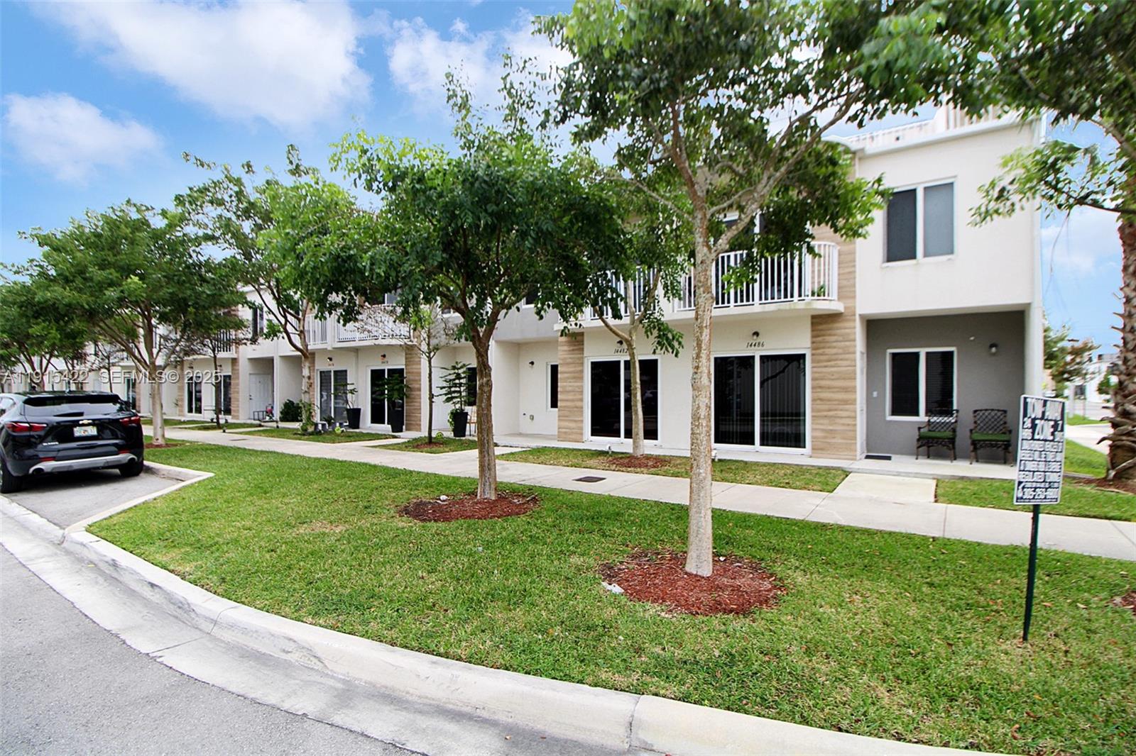 14482 Southwest 259th Street Homestead, FL 33032 - Photo 31 of 35 a front view of a house with a yard