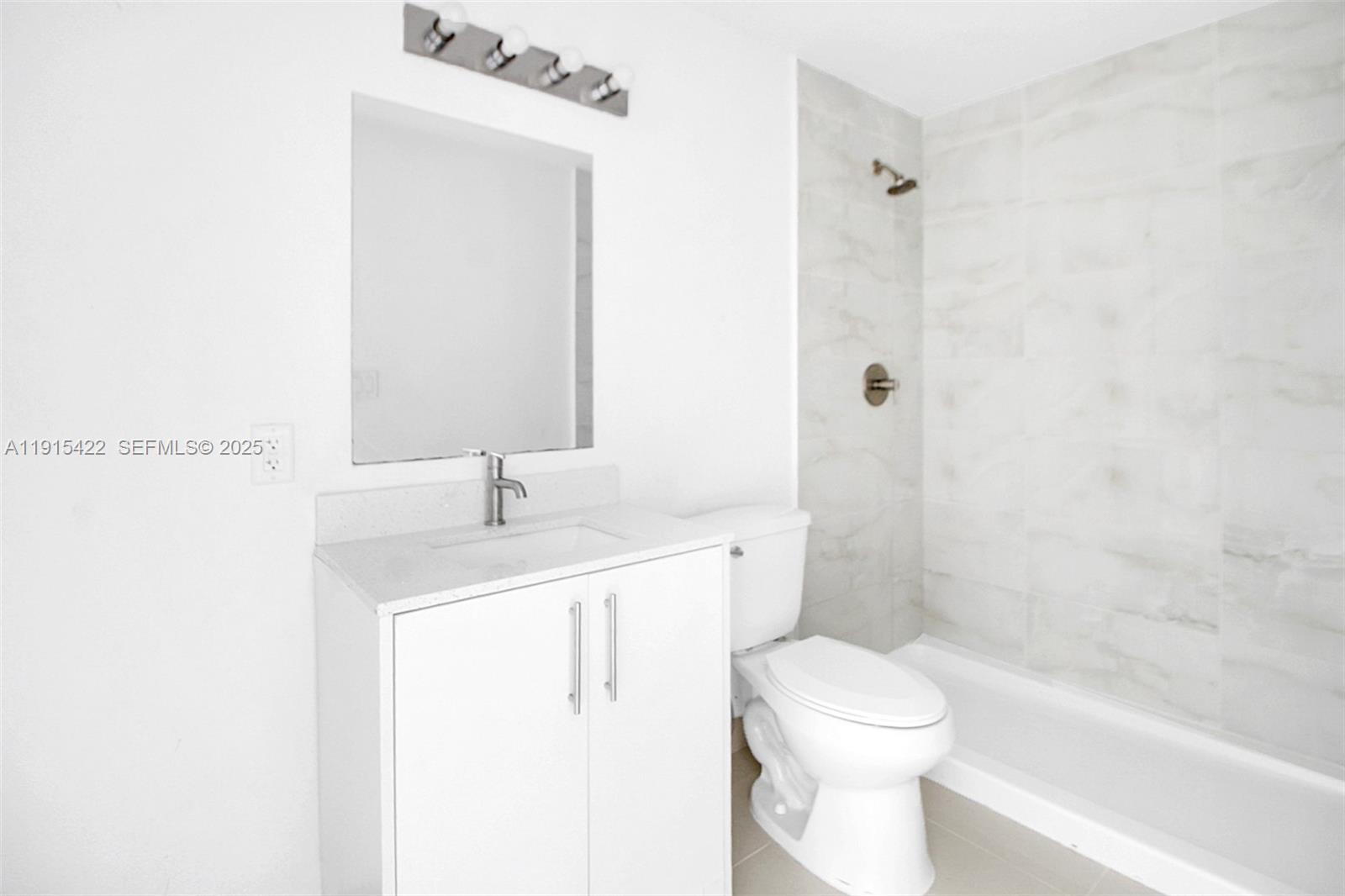 14482 Southwest 259th Street Homestead, FL 33032 - Photo 7 of 35 a bathroom with a sink a toilet and shower