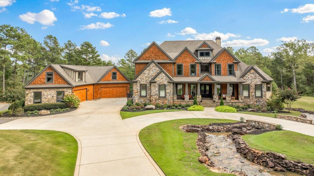 400 Harmony Road Eatonton, GA 31024 - Photo 103 of 136 a front view of a house with swimming pool having outdoor seating