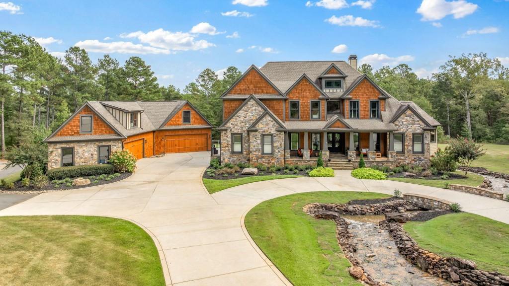 400 Harmony Road Eatonton, GA 31024 - Photo 106 of 136 a front view of a house with yard patio and green space