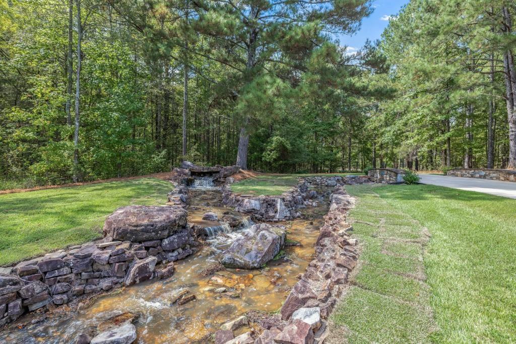 400 Harmony Road Eatonton, GA 31024 - Photo 110 of 136 a view of a backyard with large trees