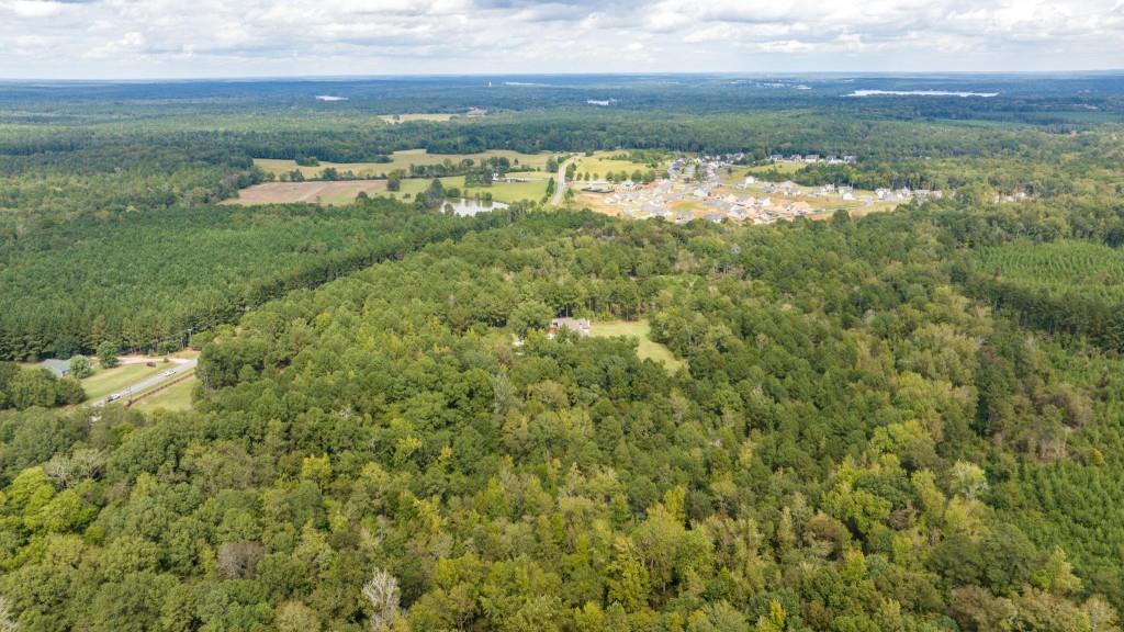 400 Harmony Road Eatonton, GA 31024 - Photo 121 of 136 a view of a lake with houses in the background