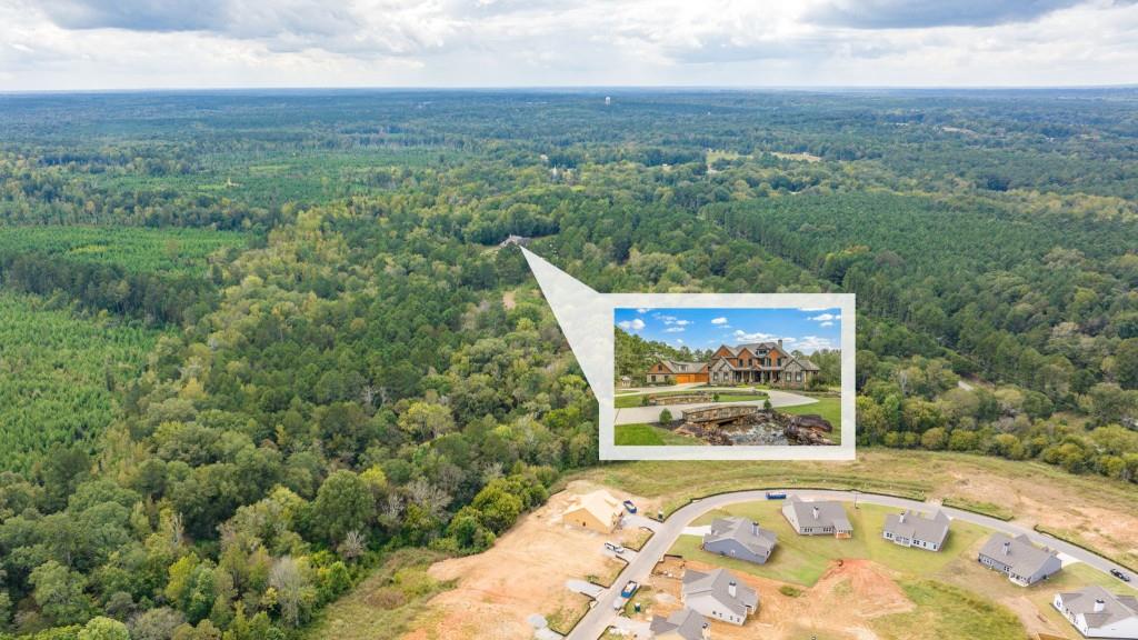 400 Harmony Road Eatonton, GA 31024 - Photo 123 of 136 an aerial view of a house with a yard