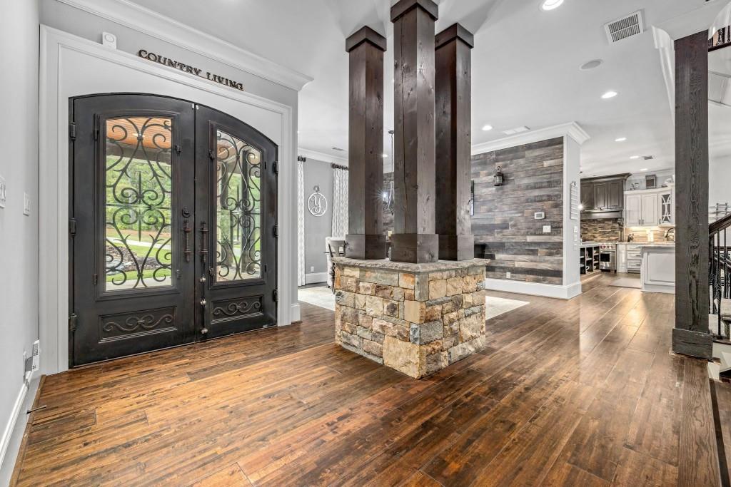 400 Harmony Road Eatonton, GA 31024 - Photo 14 of 136 a living room with furniture and a fireplace