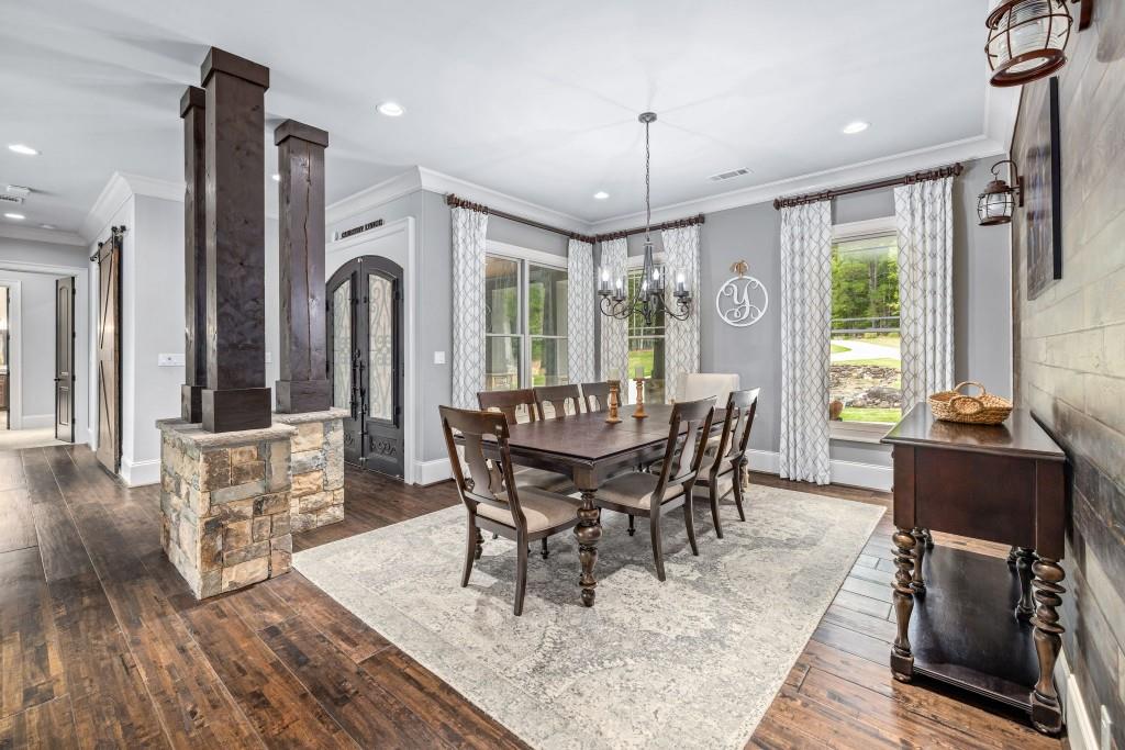 400 Harmony Road Eatonton, GA 31024 - Photo 19 of 136 a view of a dining room with furniture window and wooden floor