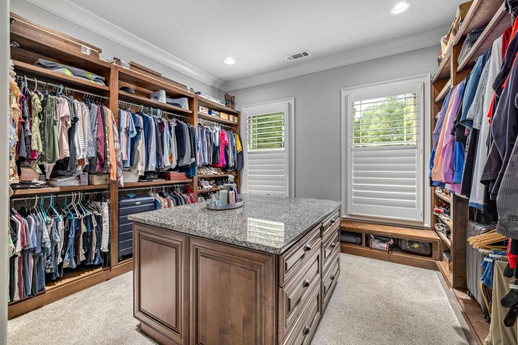 400 Harmony Road Eatonton, GA 31024 - Photo 39 of 136 a view of walk in closet with clothes and shoes