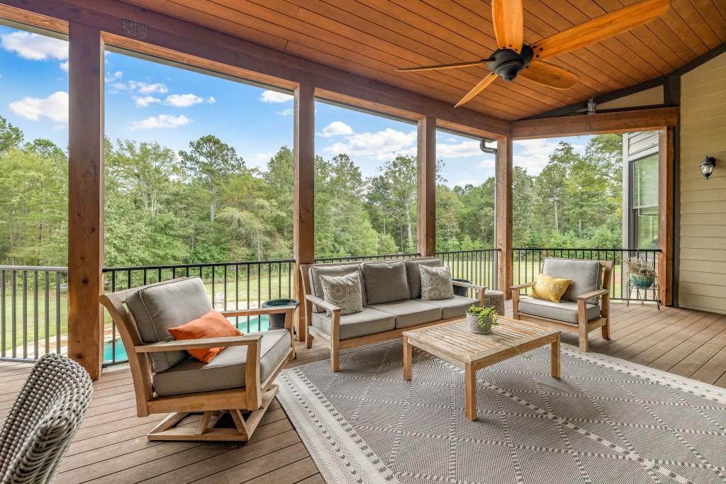 400 Harmony Road Eatonton, GA 31024 - Photo 42 of 136 a living room with furniture and a large window