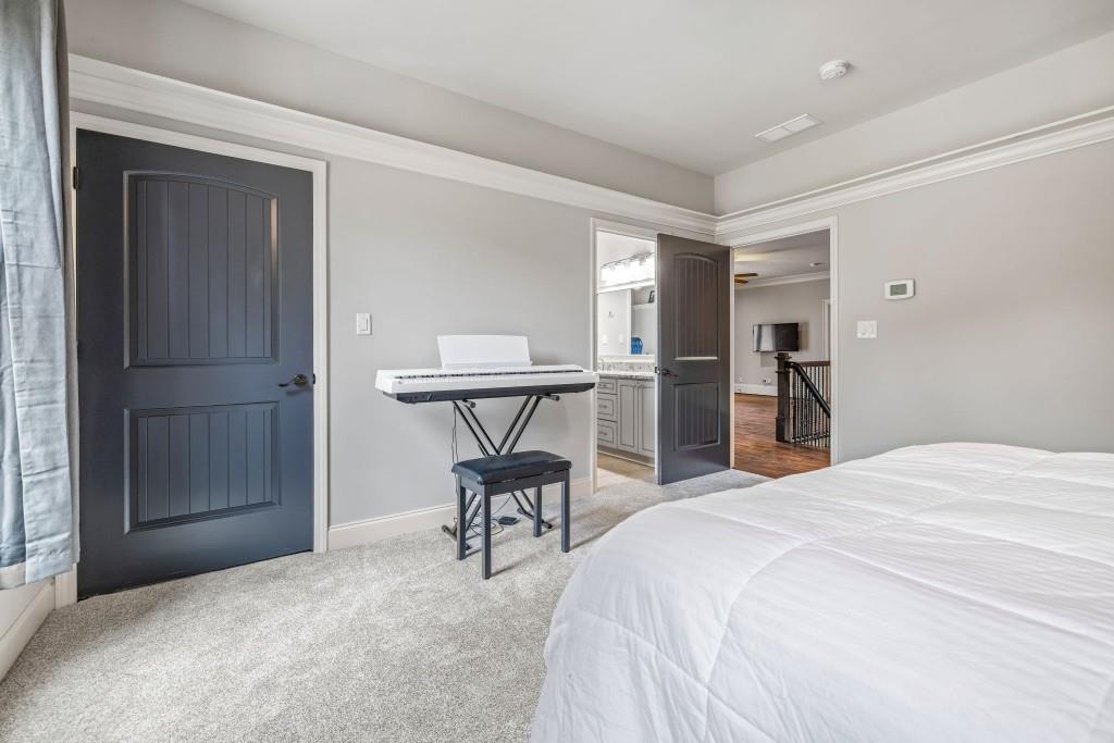 400 Harmony Road Eatonton, GA 31024 - Photo 56 of 136 a bedroom with a bed and a table